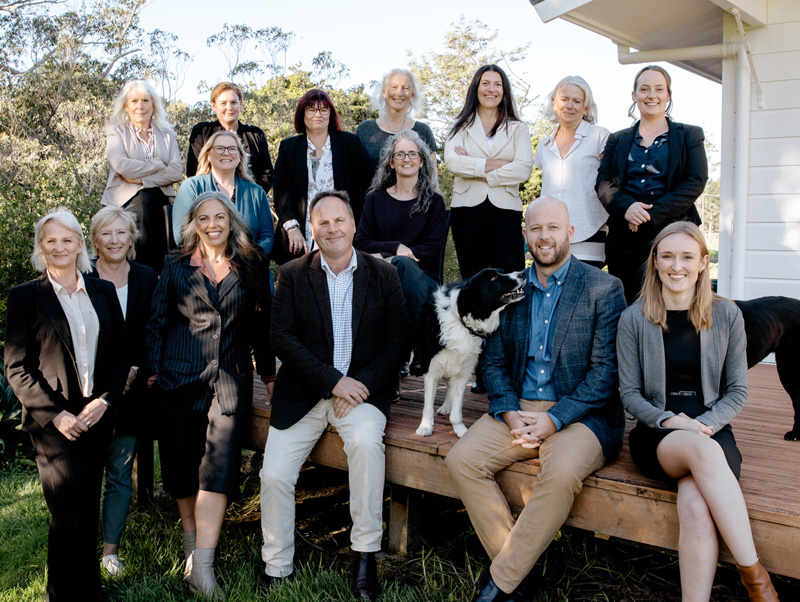Sellars team sitting on a deck